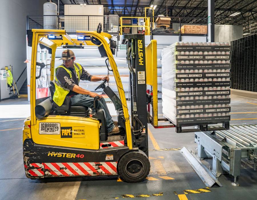 Pallets being moved in a distribution warehouse